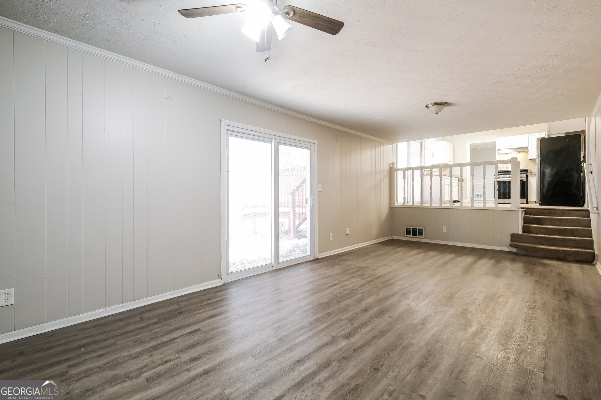 3660 Sterling Ridge Way Decatur, GA 30032 - Photo 3 of 23 an empty room with wooden floor and windows