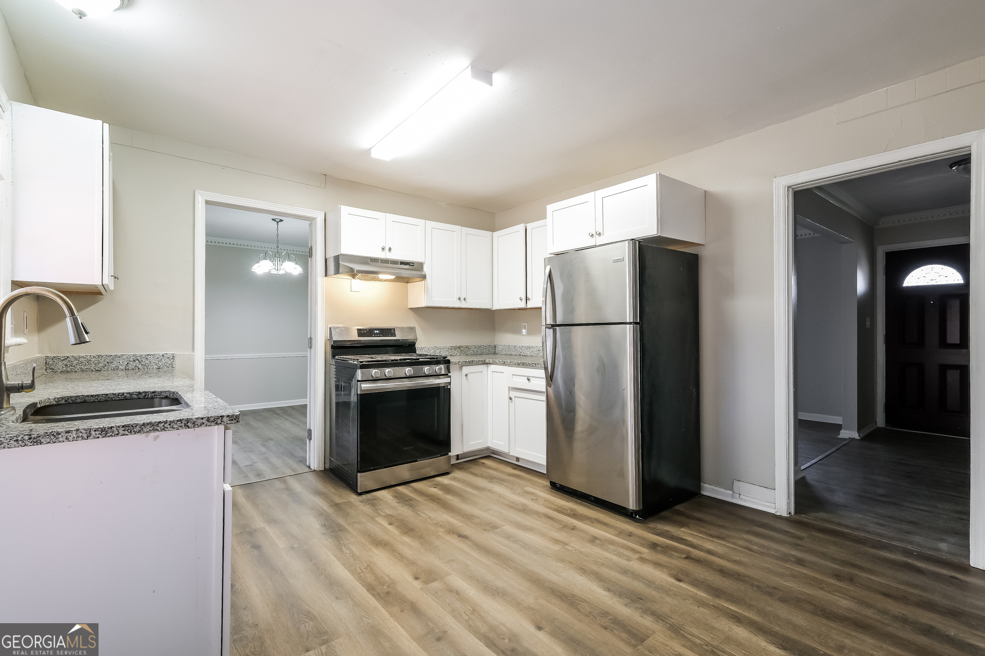 3660 Sterling Ridge Way Decatur, GA 30032 - Photo 7 of 23 a kitchen with a refrigerator and a sink