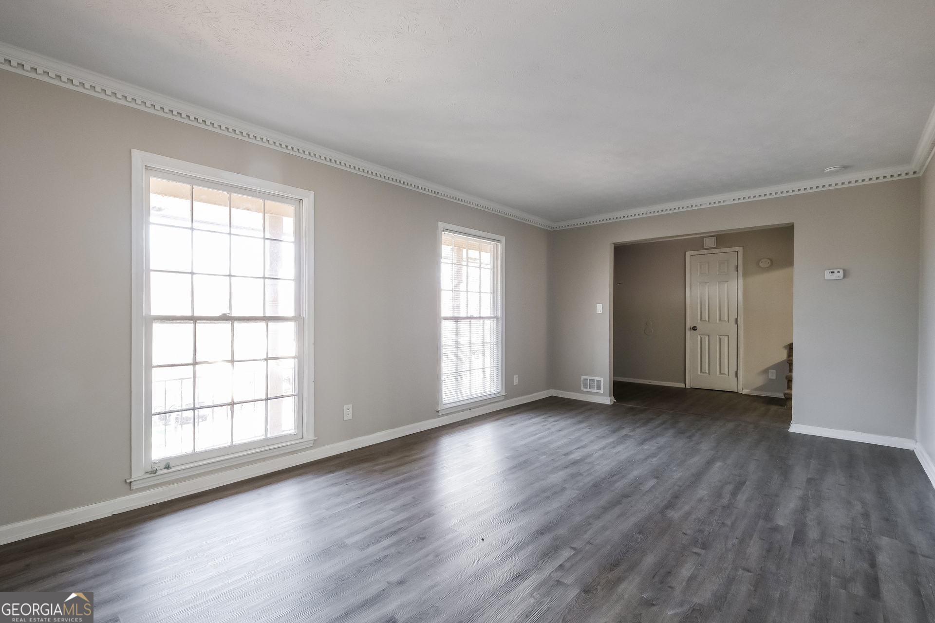 3660 Sterling Ridge Way Decatur, GA 30032 - Photo 9 of 23 an empty room with wooden floor and windows