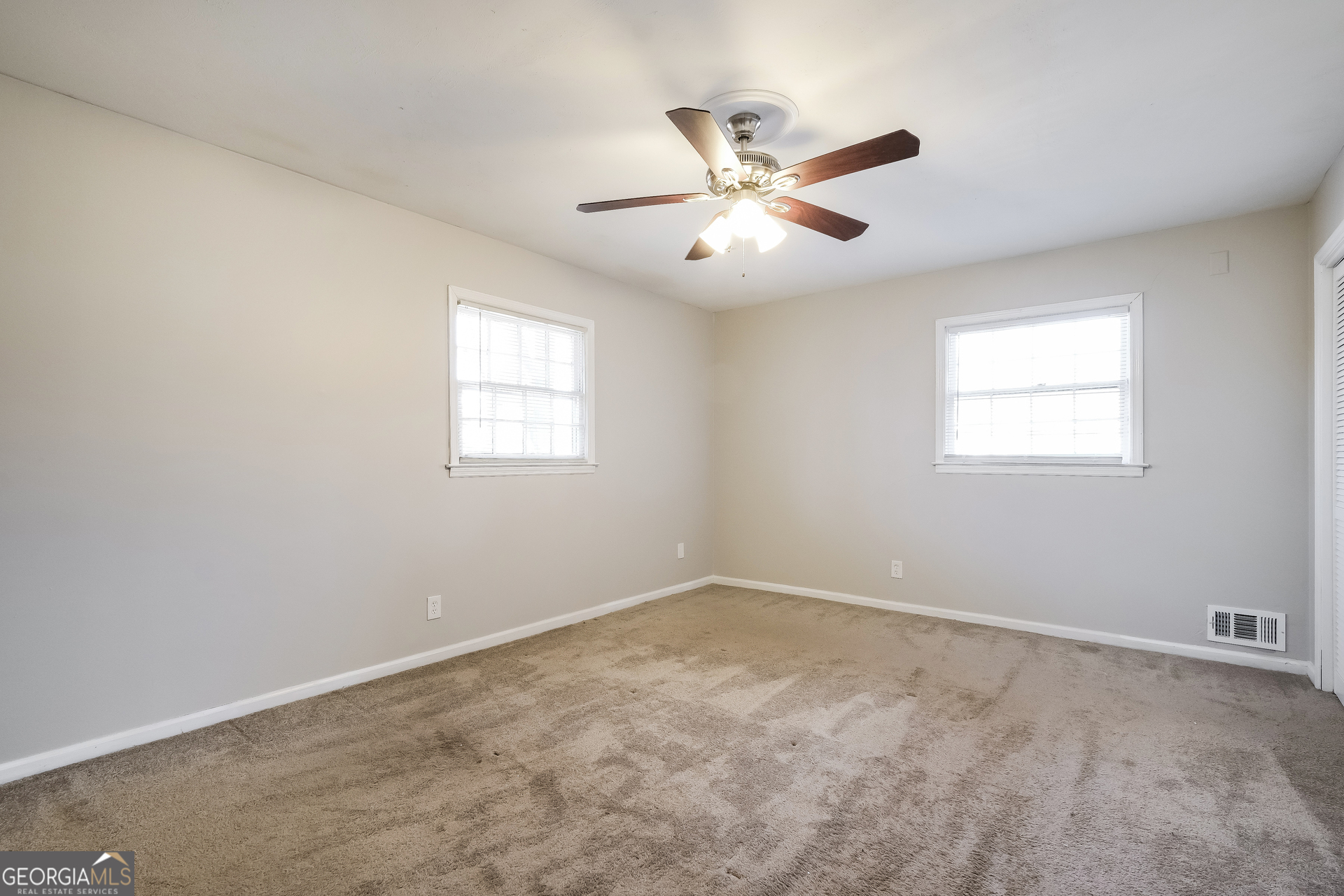 3660 Sterling Ridge Way Decatur, GA 30032 - Photo 10 of 23 an empty room with windows and fan