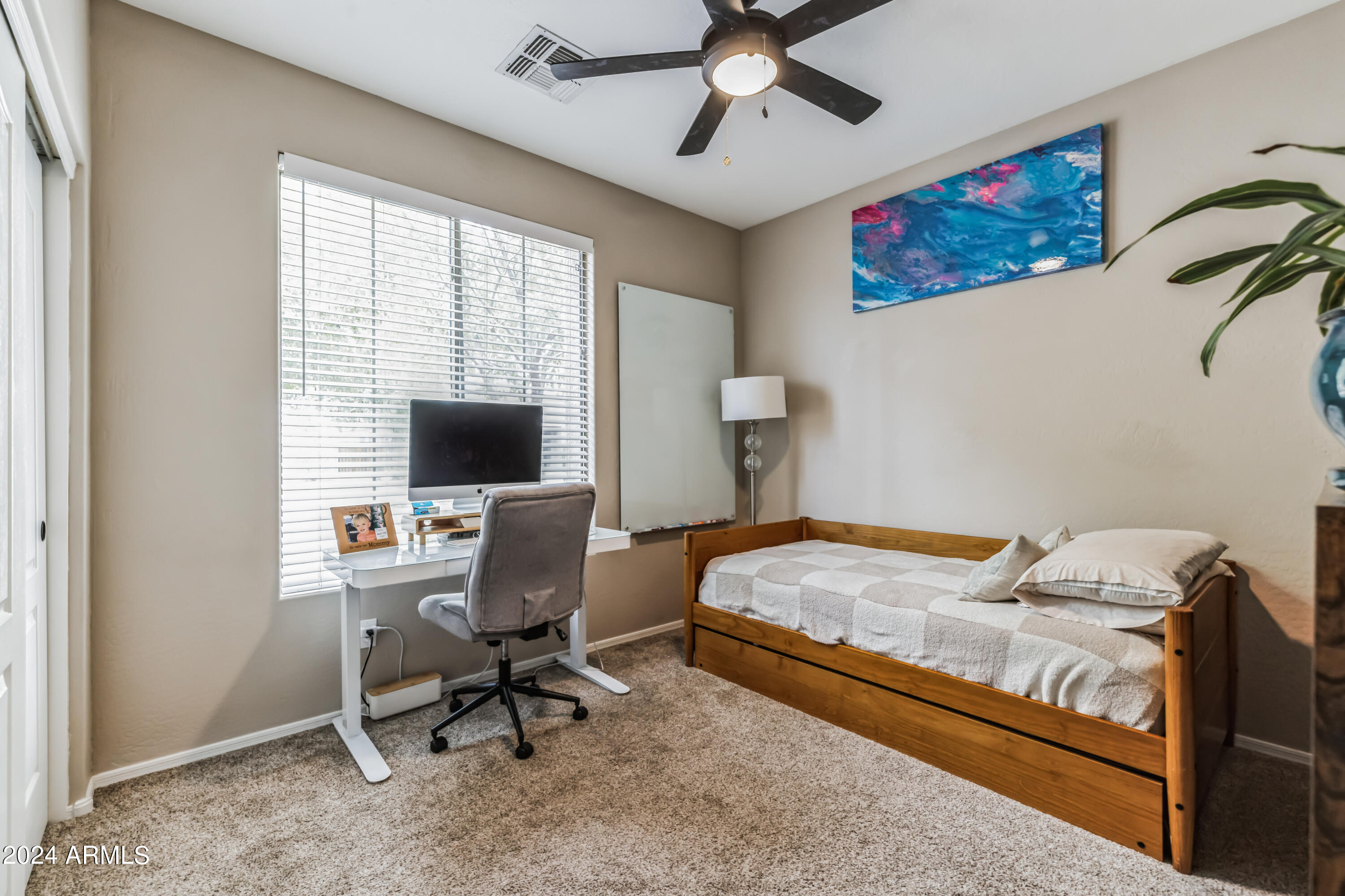 2535 South Martingale Road Gilbert, AZ 85295 - Photo 15 of 25 a bedroom with a bed and a window