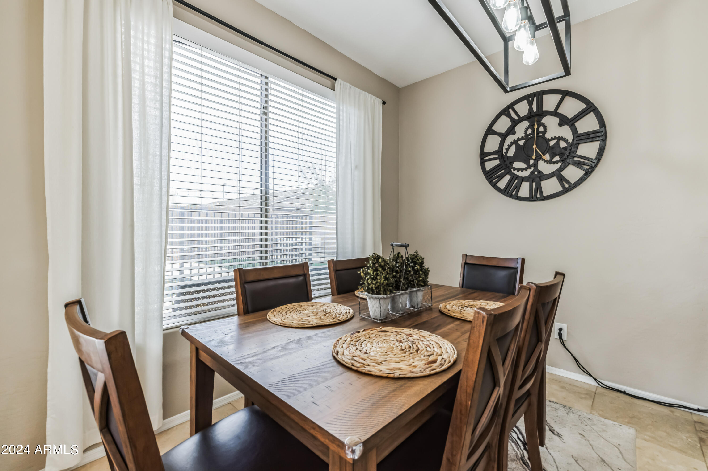 2535 South Martingale Road Gilbert, AZ 85295 - Photo 8 of 25 a view of a dining room with furniture window and wooden floor