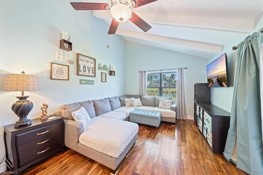 463 Torrey Pines Point Naples, FL 34113 - Photo 8 of 24 a living room with furniture and a flat screen tv