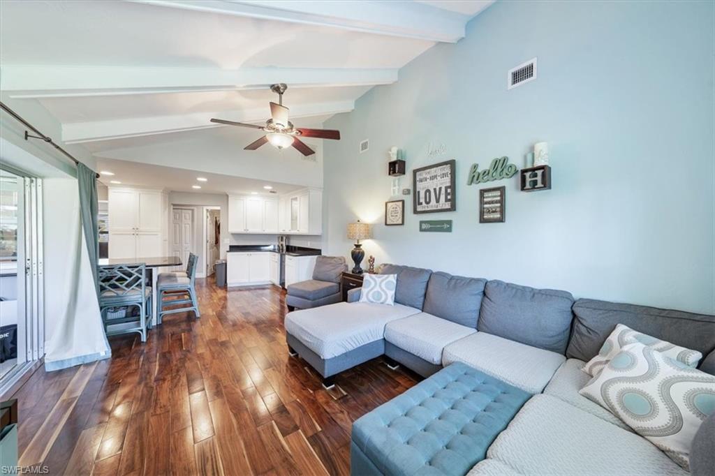 463 Torrey Pines Point Naples, FL 34113 - Photo 9 of 24 a living room with furniture and wooden floor
