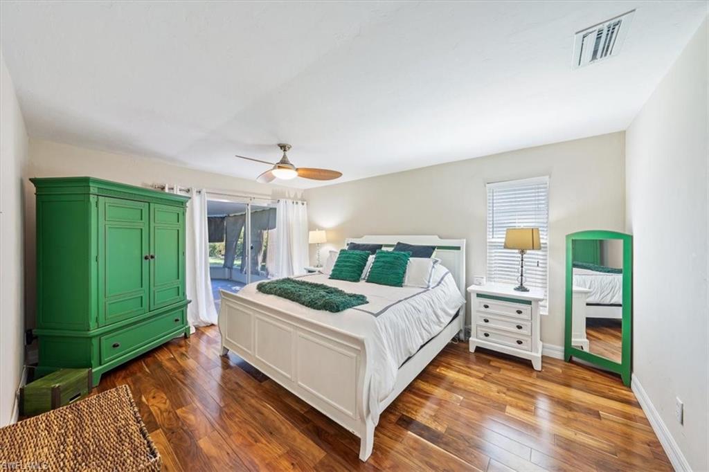 463 Torrey Pines Point Naples, FL 34113 - Photo 10 of 24 a bedroom with a bed and a window