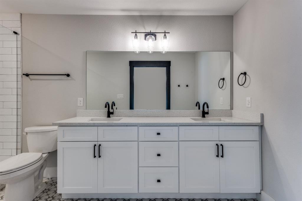 1752 Palladio Loop Princeton, TX 75407 - Photo 8 of 18 a bathroom with a sink and a mirror