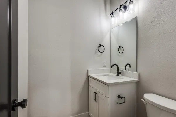 a bathroom with a sink and mirror