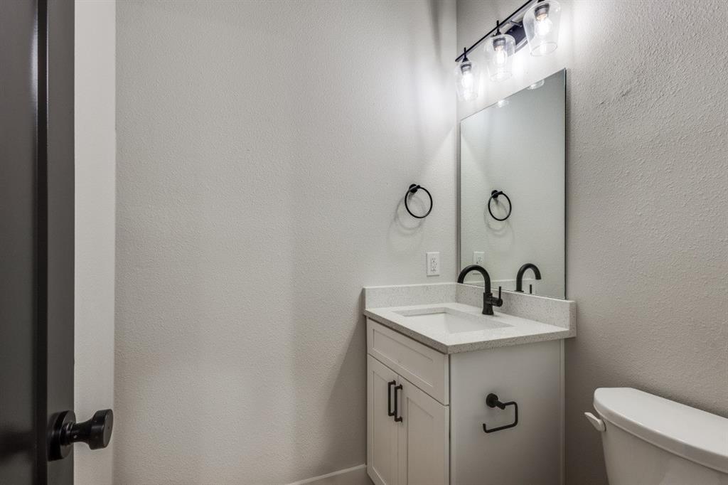 1752 Palladio Loop Princeton, TX 75407 - Photo 10 of 18 a bathroom with a sink and mirror
