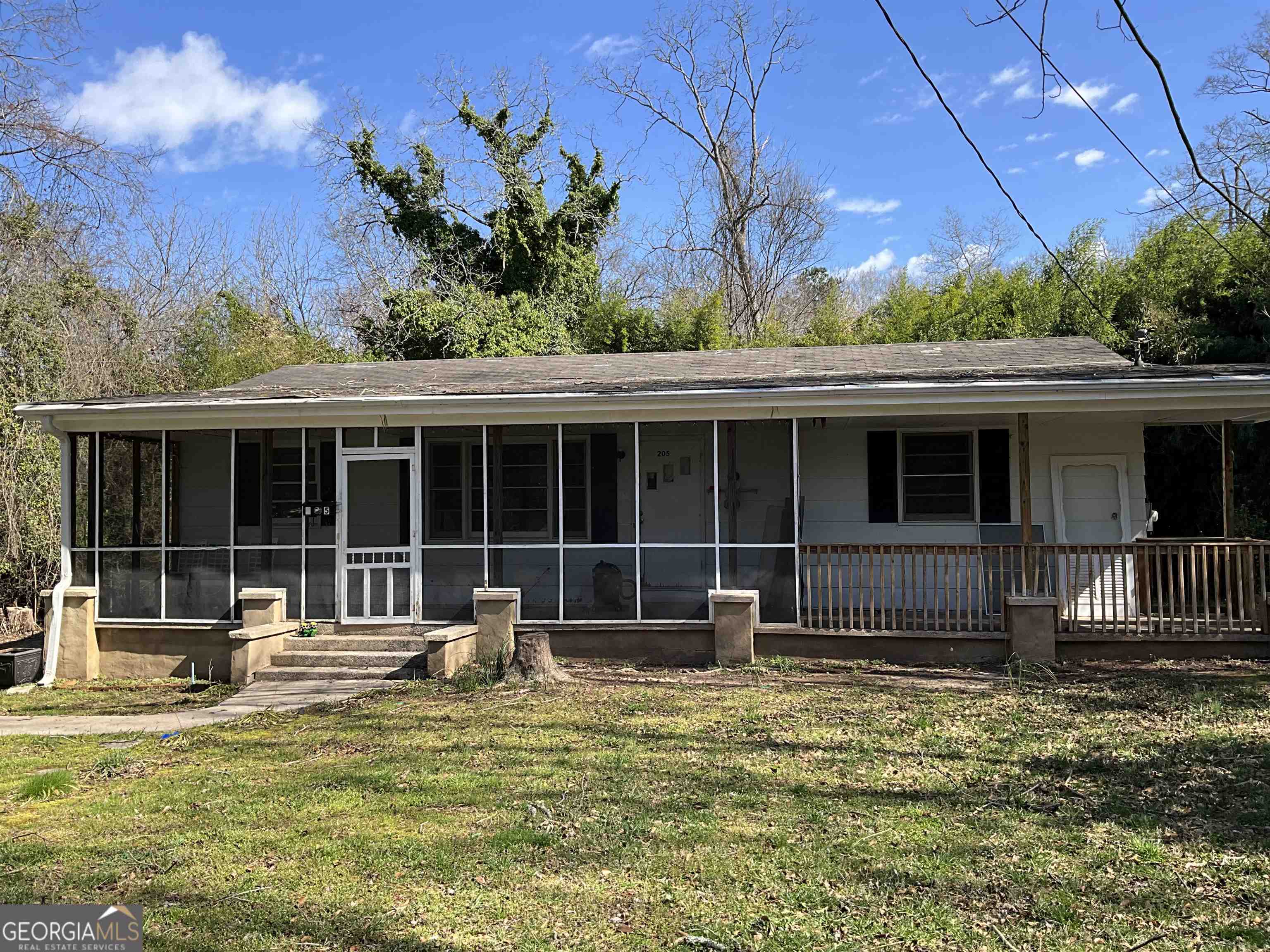 205 Crawfordville Road Union Point, GA 30669 - Photo 1 of 1 a house with swimming pool in front of it