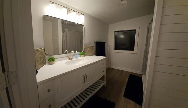 a bathroom with a sink and a mirror