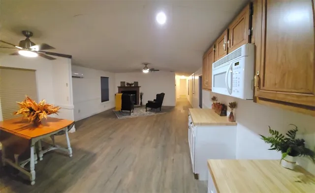 a view of a dining room with furniture and a chandelier