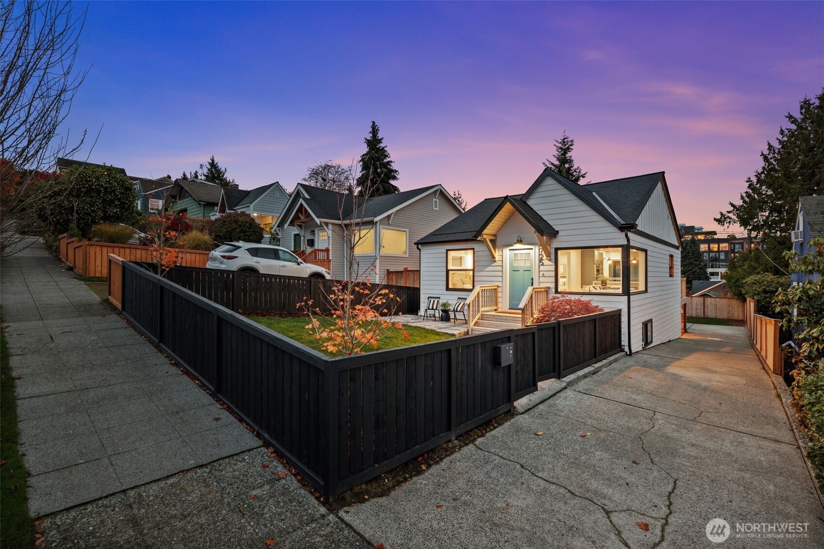 4725 37th Avenue Southwest Seattle, WA 98126 - Photo 1 of 37 a view of a house with wooden fence