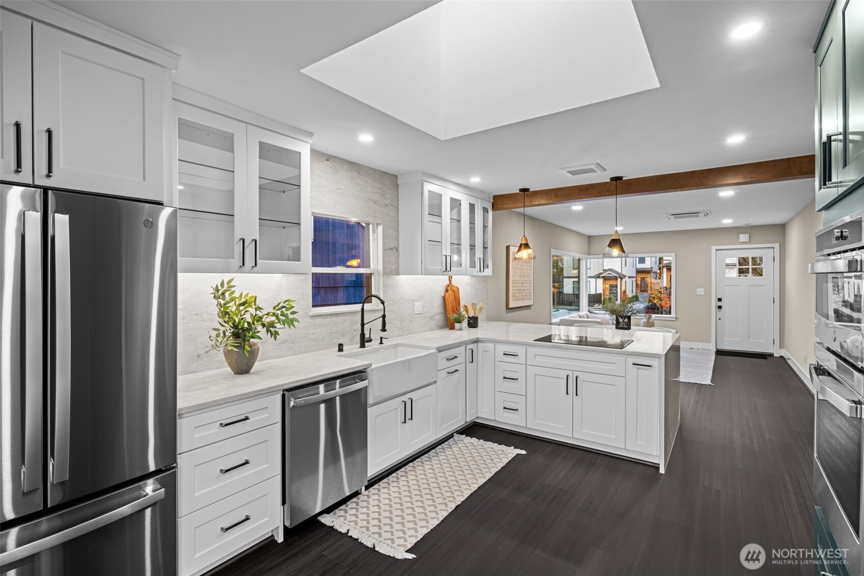 4725 37th Avenue Southwest Seattle, WA 98126 - Photo 11 of 37 a kitchen with white cabinets and refrigerator