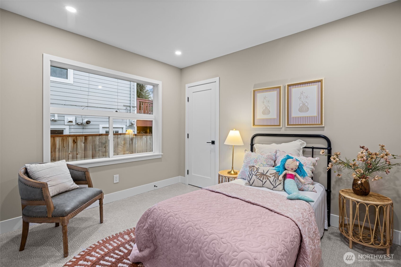 4725 37th Avenue Southwest Seattle, WA 98126 - Photo 15 of 37 a bedroom with a bed and a chair