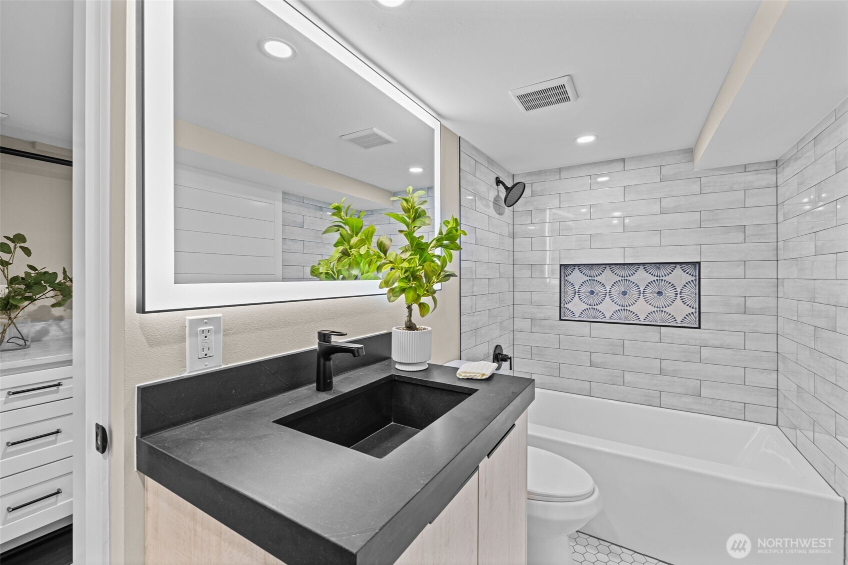 4725 37th Avenue Southwest Seattle, WA 98126 - Photo 20 of 37 a bathroom with a sink a toilet and a bathtub