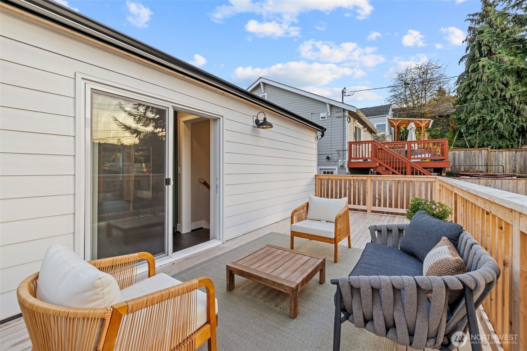 4725 37th Avenue Southwest Seattle, WA 98126 - Photo 26 of 37 a balcony with chairs and a potted plant