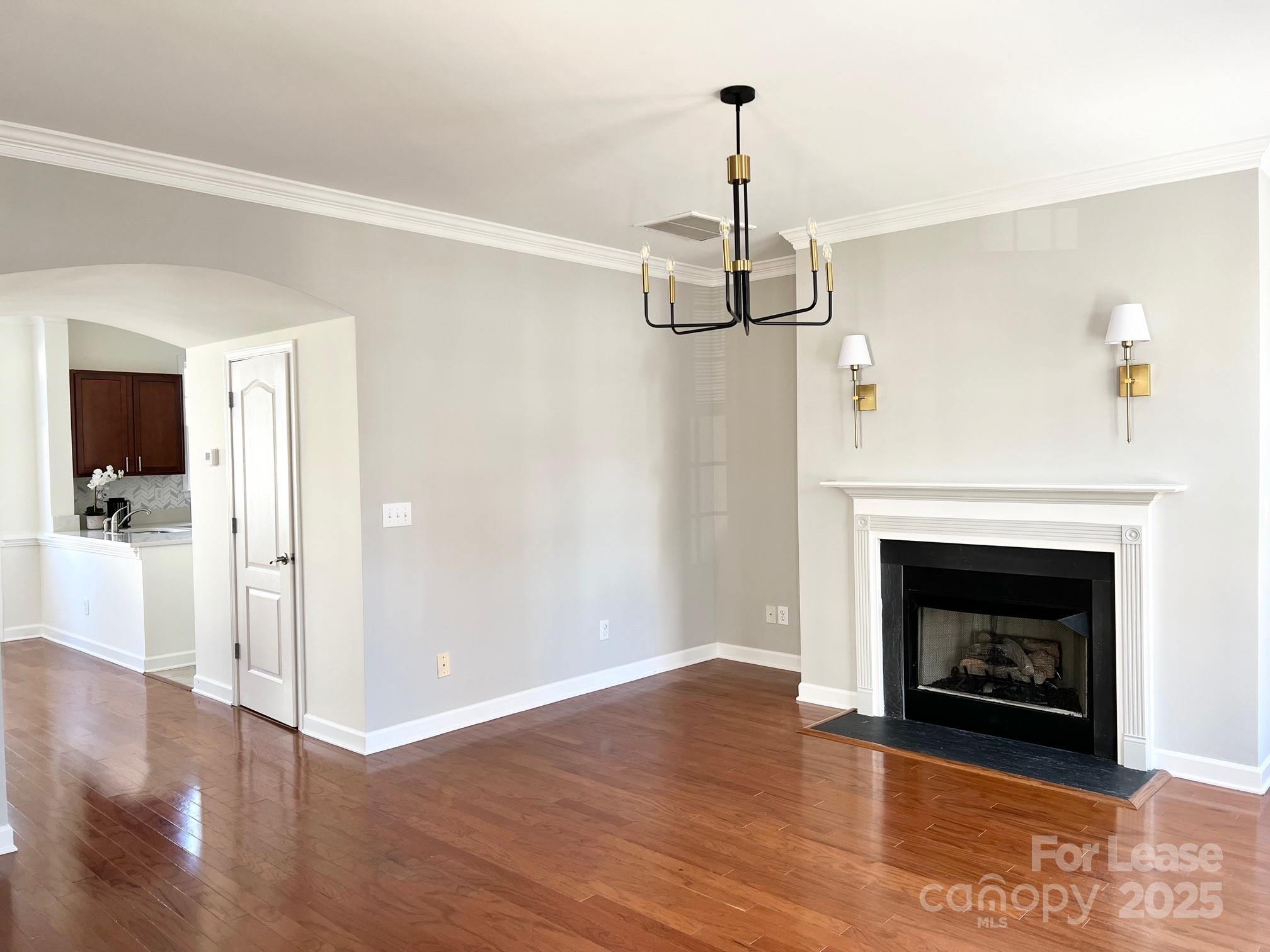630 Old Meeting Way Davidson, NC 28036 - Photo 3 of 19 a living room with a fireplace