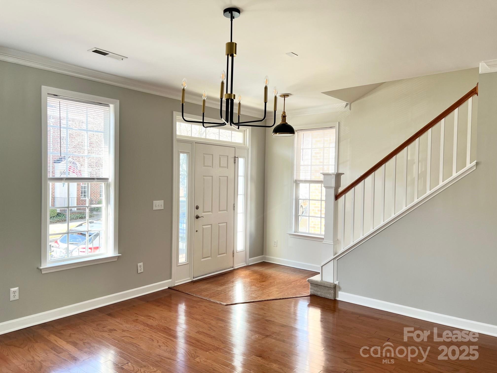 630 Old Meeting Way Davidson, NC 28036 - Photo 4 of 19 a view of empty room with wooden floor and fan