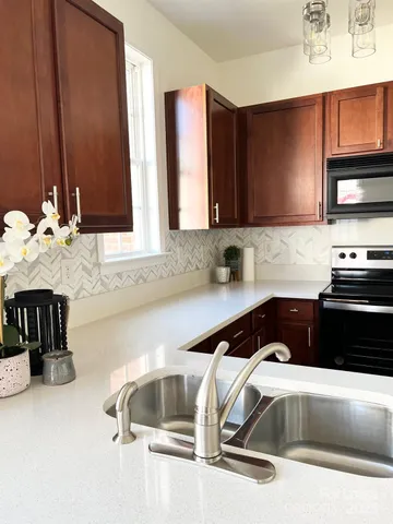 a kitchen with a sink and cabinets