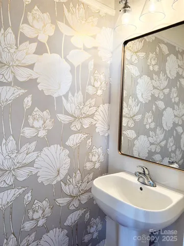 a bathroom with a sink and mirror