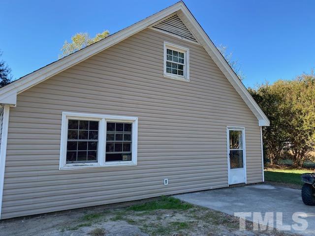 2268 Sanders Road Willow Spring, NC 27592 - Photo 11 of 11 a view of a house next to a yard
