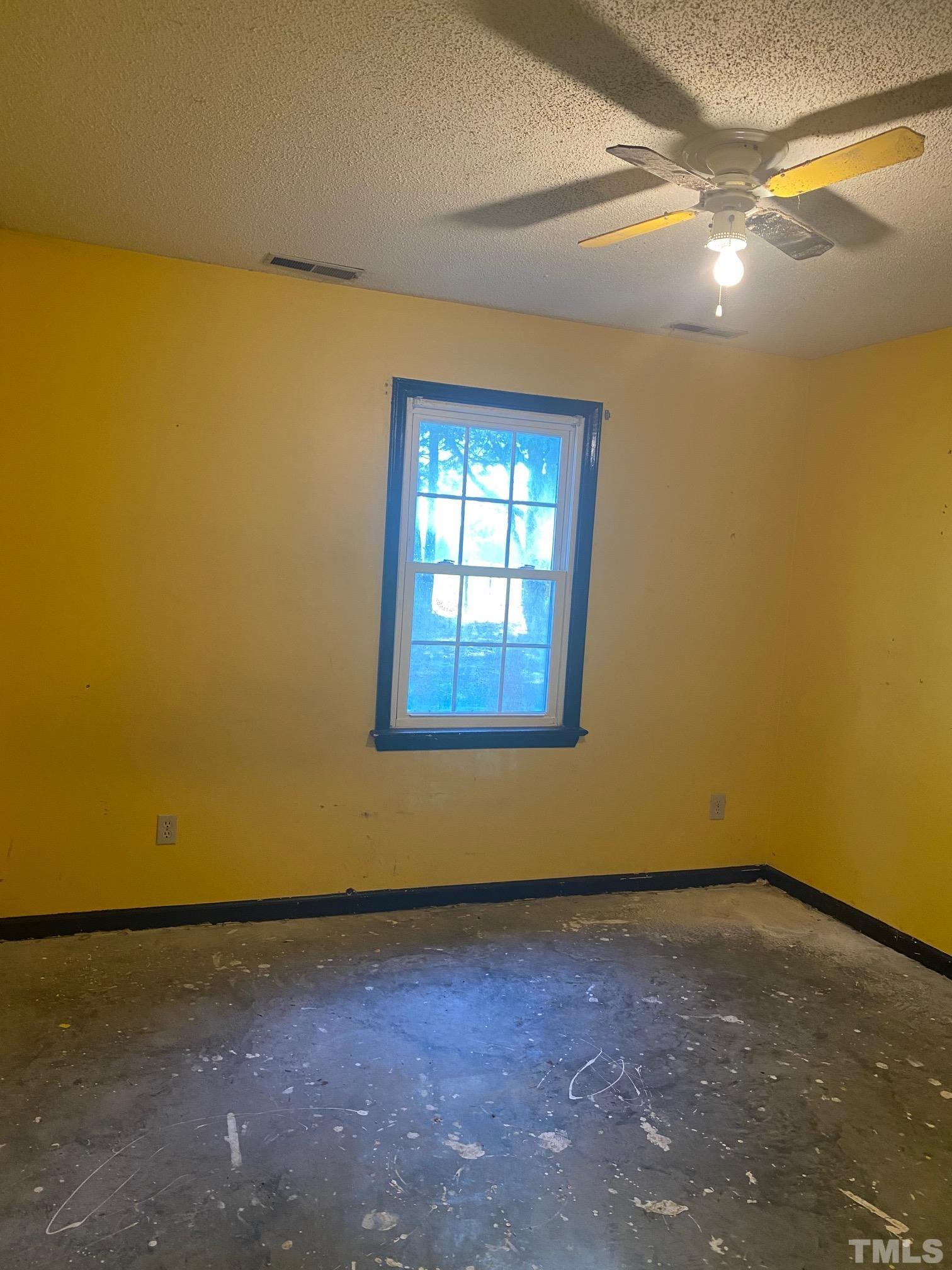 2268 Sanders Road Willow Spring, NC 27592 - Photo 7 of 11 a view of an empty room with a window