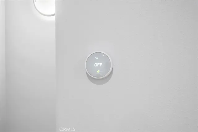 a wall with a close up of a mirror