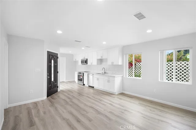 a view of a kitchen with windows