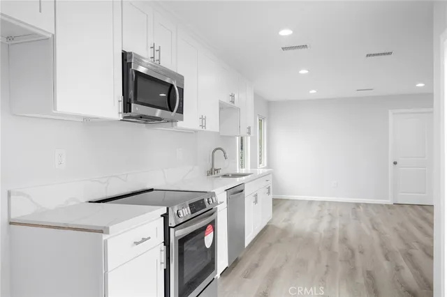 a kitchen with a stove and a microwave