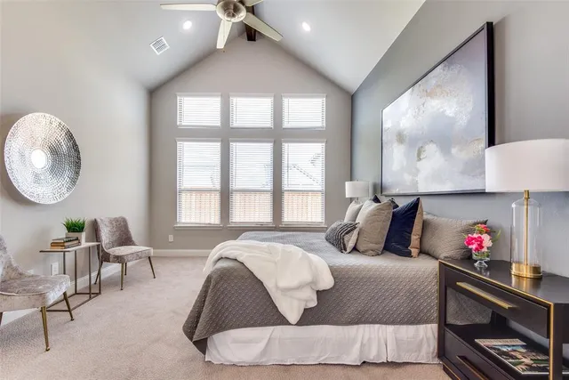 a bed room with a bed mirror and a large window