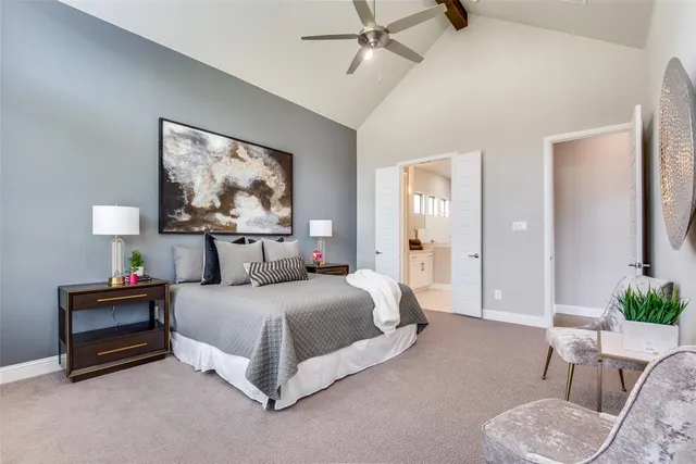 a bedroom with a bed and a chair