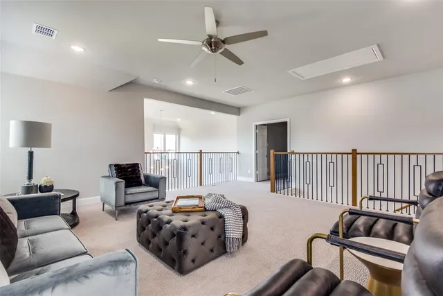 a bedroom with furniture and wooden floor