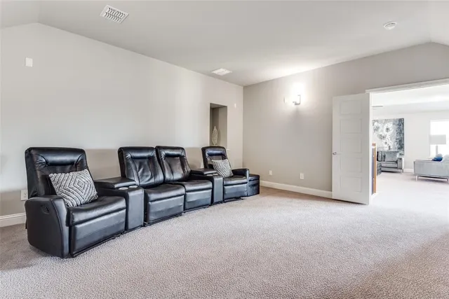 a balcony with furniture and a potted plant