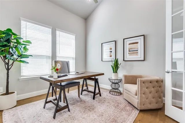 a view of a livingroom with furniture and a potted plant