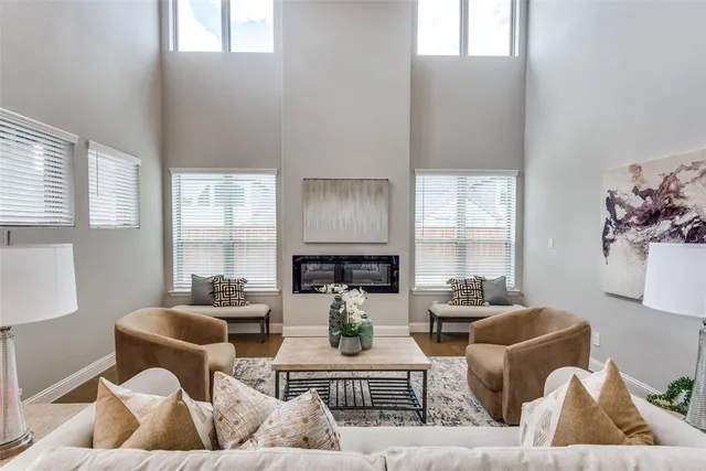 a living room with furniture or couch and a large window