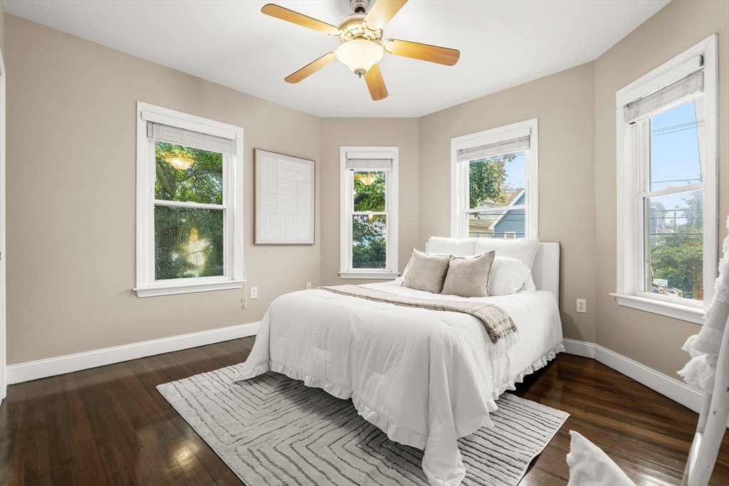 77 Wheatland Street, Unit 2 Somerville, MA 02145 - Photo 14 of 20 a bedroom with a large bed and a window