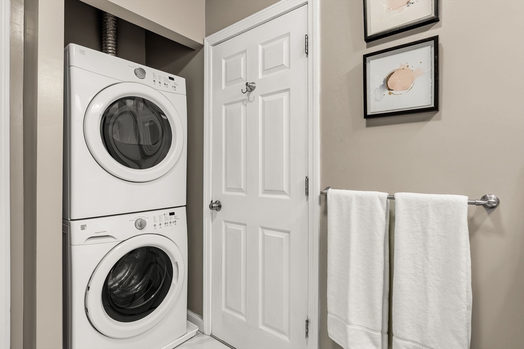 77 Wheatland Street, Unit 2 Somerville, MA 02145 - Photo 16 of 20 a view of a hallway with washer and dryer