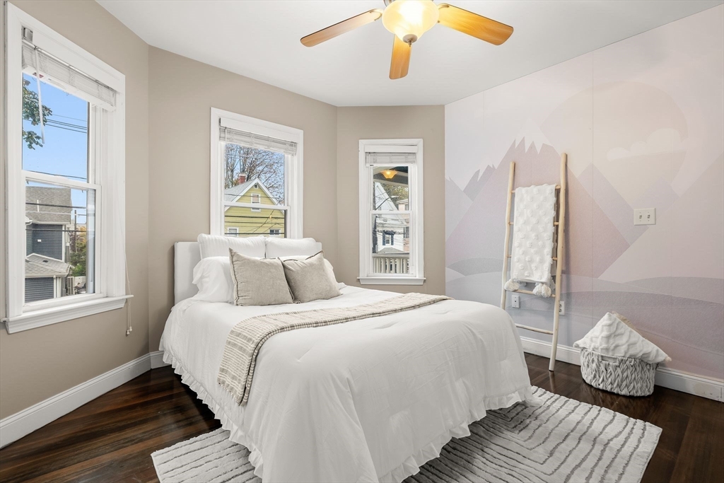 77 Wheatland Street, Unit 2 Somerville, MA 02145 - Photo 3 of 20 a bedroom with bed and window