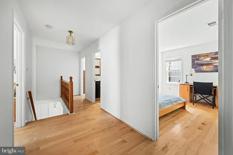 a bedroom with a bed and a view of en suite bathroom