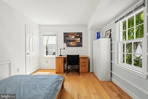 a workspace with furniture and a window
