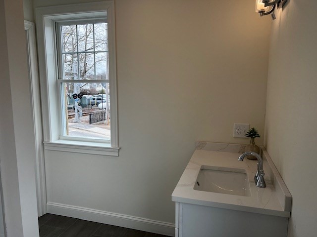 1 Pleasant Street, Unit 201 Cohasset, MA 02025 - Photo 16 of 20 a bathroom with a sink and window