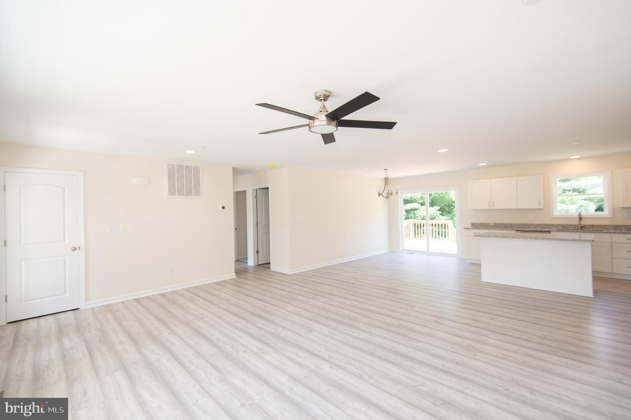 6706 Jayar Way Hurlock, MD 21643 - Photo 3 of 19 wooden floor in an empty room with a window