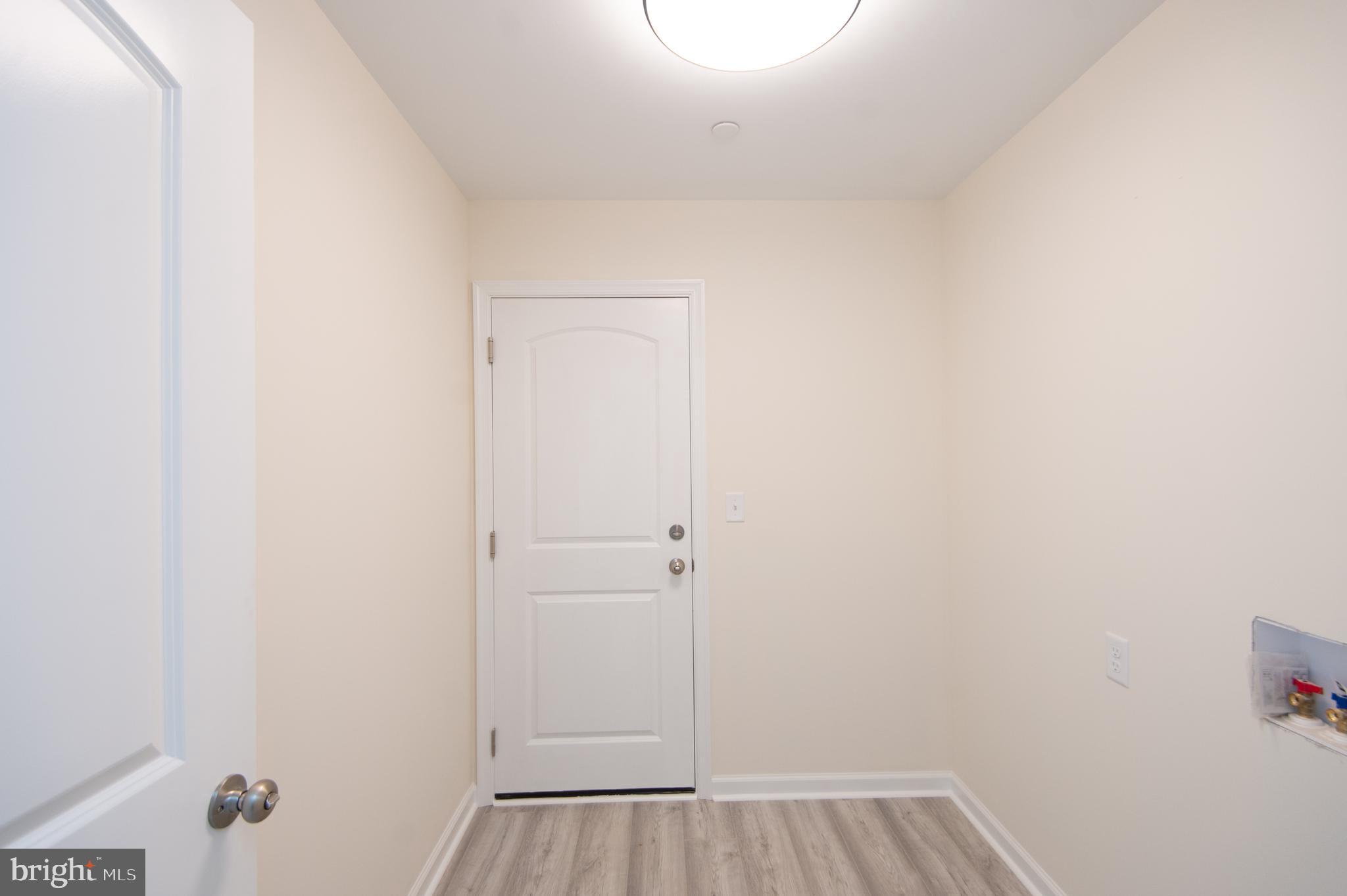 6706 Jayar Way Hurlock, MD 21643 - Photo 8 of 19 a view of a room with wooden floor
