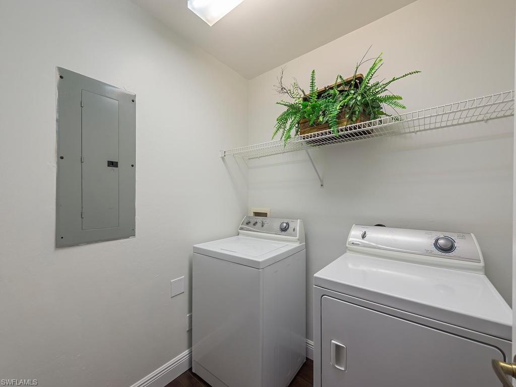 5470 16th Place Southwest, Unit 103 Naples, FL 34116 - Photo 12 of 12 a utility room with dryer and washer