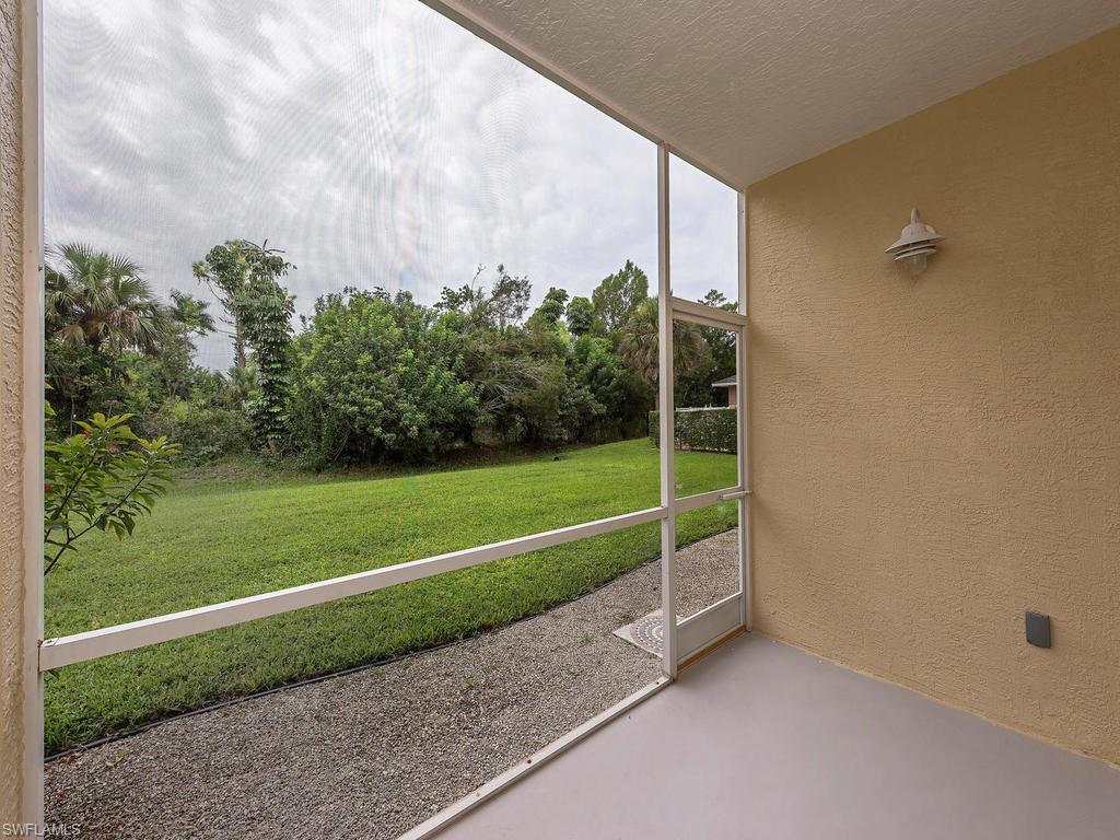 5470 16th Place Southwest, Unit 103 Naples, FL 34116 - Photo 7 of 12 a view of a field with grass and plants