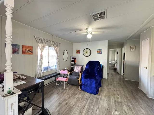 a view of a livingroom with furniture and a window