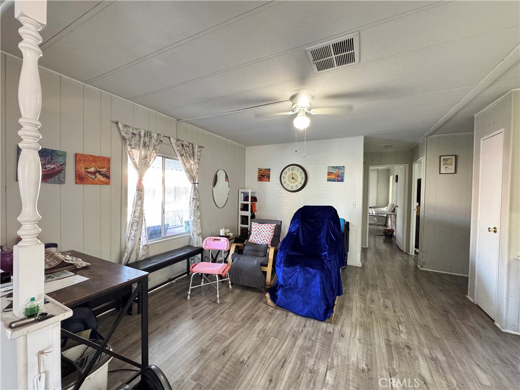 9800 Base Line Road, Unit 76 Rancho Cucamonga, CA 91701 - Photo 14 of 20 a view of a livingroom with furniture and a window