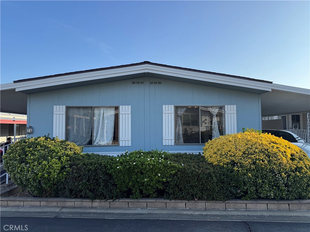 9800 Base Line Road, Unit 76 Rancho Cucamonga, CA 91701 - Photo 2 of 20 a front view of a house with a yard
