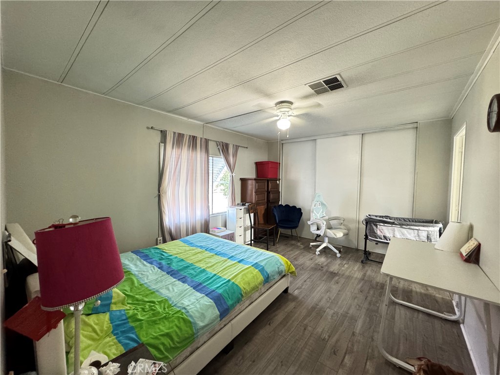 9800 Base Line Road, Unit 76 Rancho Cucamonga, CA 91701 - Photo 10 of 20 a bed room with a bed window and a chair