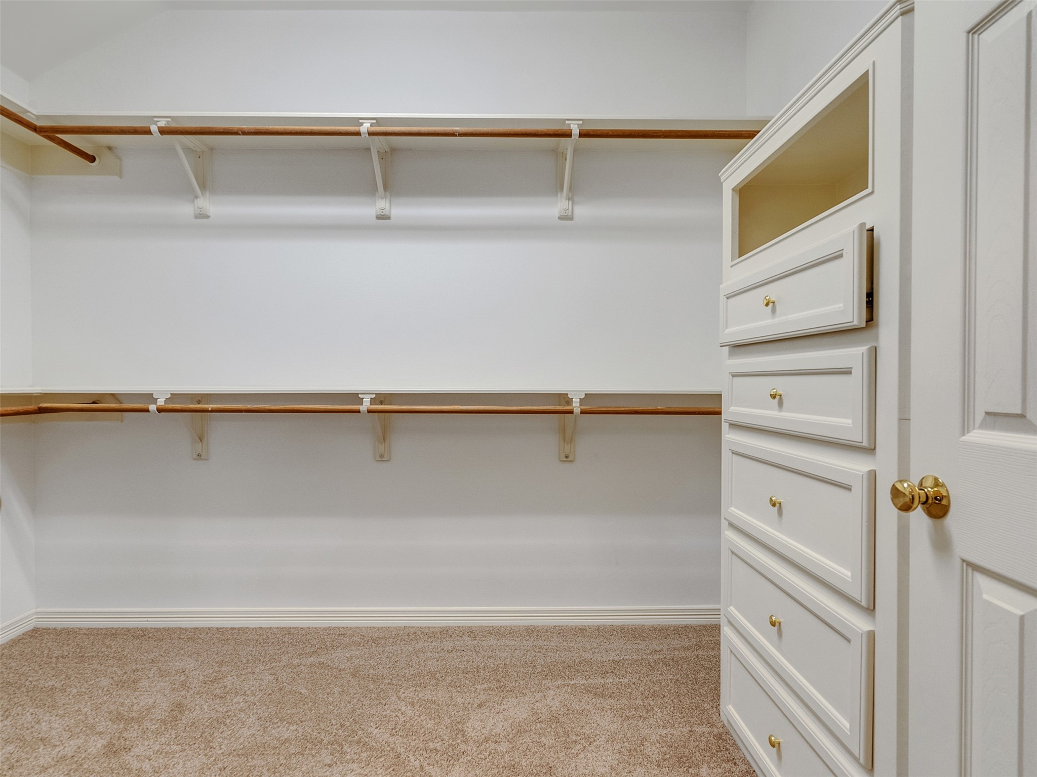 195 Coral Gables Trinity, TX 75862 - Photo 25 of 50 Primary closet has drawers and shelves for storage.